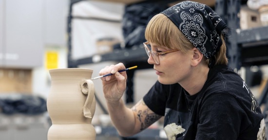 Anna Bultman working on a ceramic piece in the Jackson Dinsdale Art Center. (Photo by Matt Urbanski)