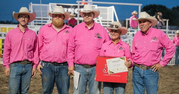 Logan Zeckser (far left) and Cindy Hinrichs, second from right, were awarded the Volunteer of the Year and the Committee Person of the Year, respectively, for their work with the Oregon Trail Rodeo in Hastings, Neb. Presenting the awards is, from left to right, Patrick Niles, Scott Hinrichs, and Dwight Dunsworth. Photo by Anita Burcham.